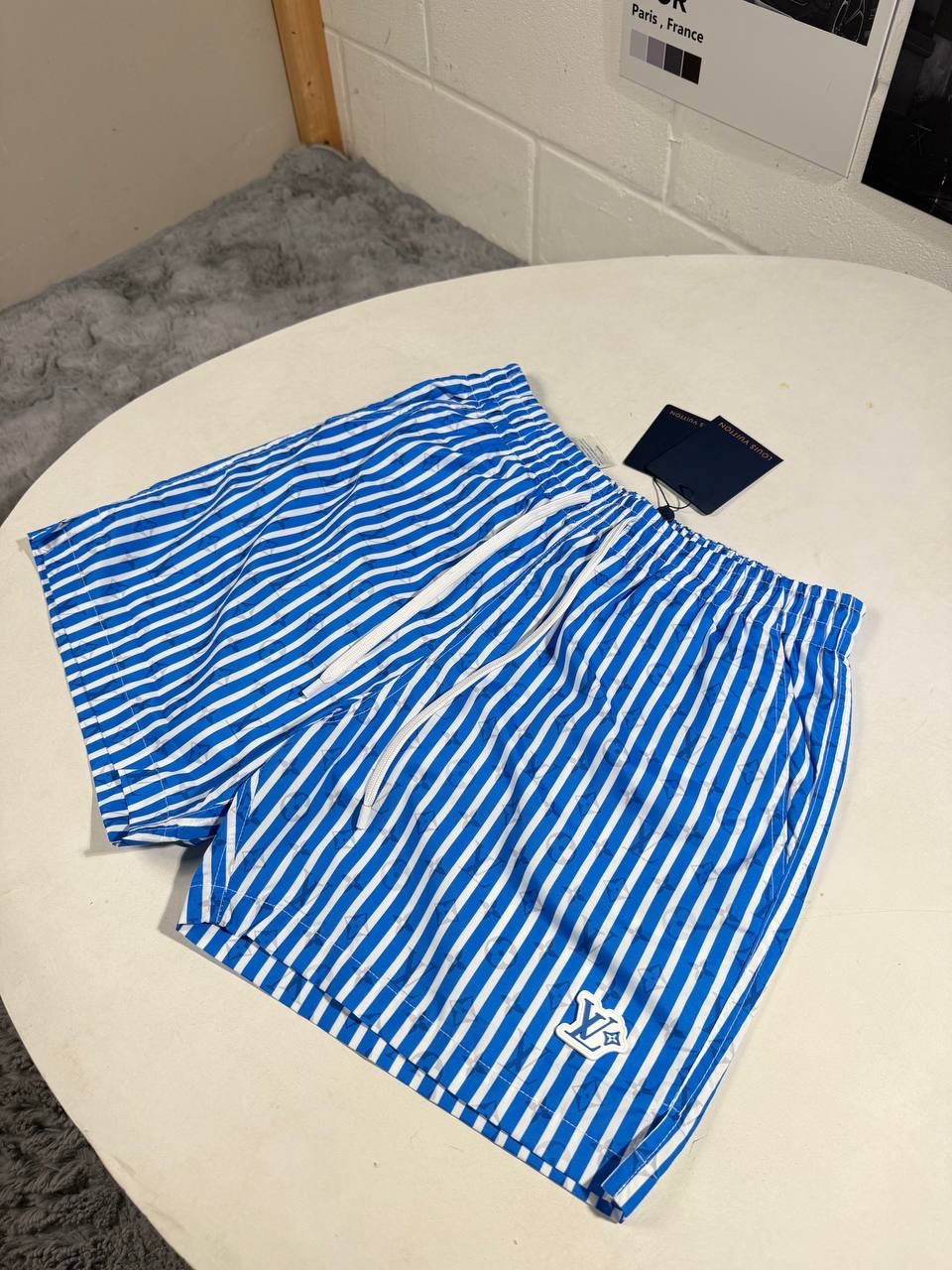 LVE MONOGRAM STRIPPED SWIM SHORTS