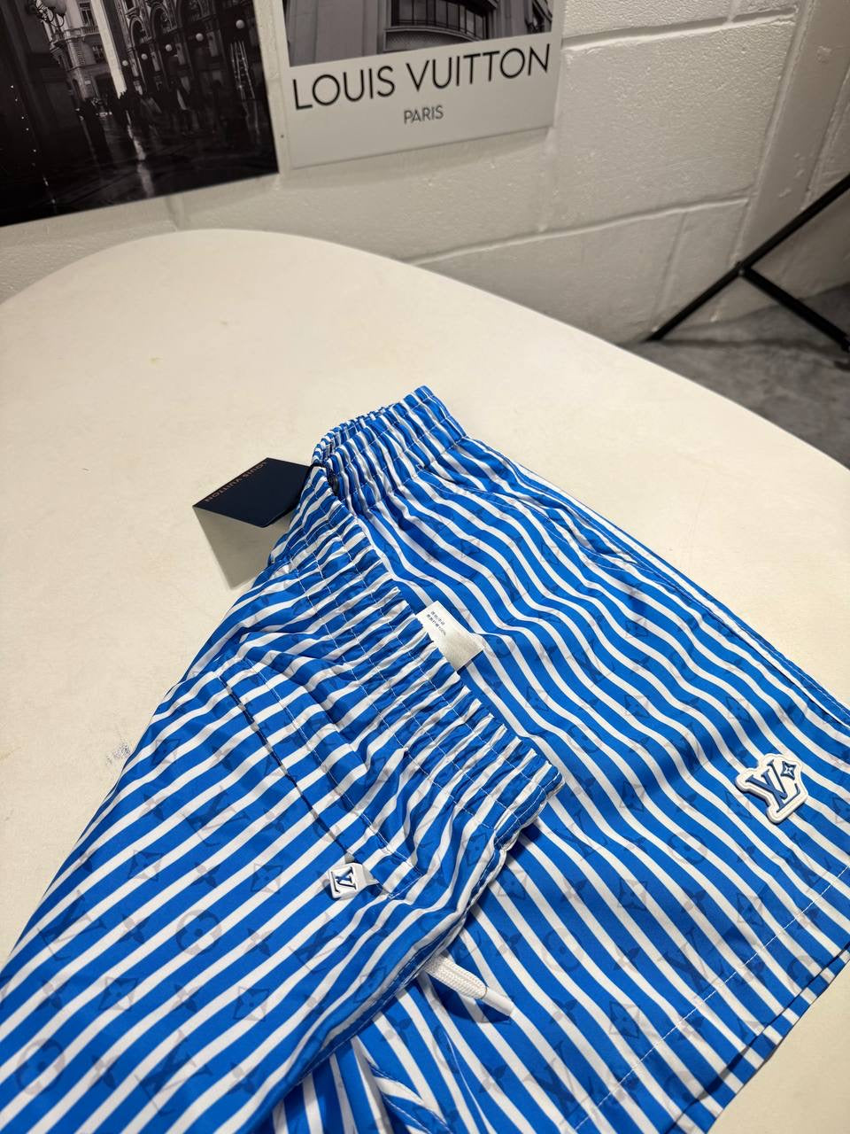 LVE MONOGRAM STRIPPED SWIM SHORTS